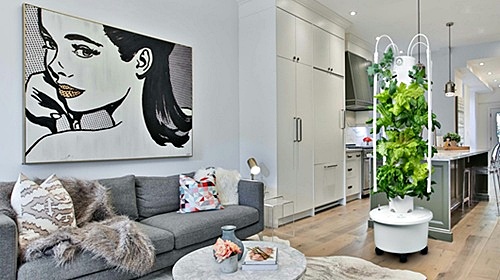 Aeroponic tower in a modern home next to the kitchen
