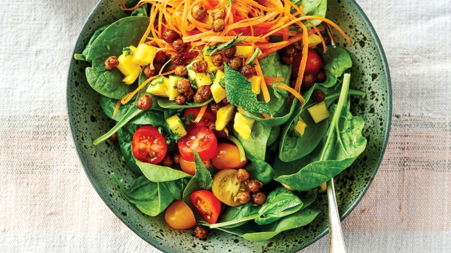 bowl of salad with tomatoes and spinach